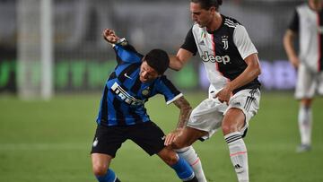 Juventus's Stefano Sensi (R) fights for the ball with Inter Milan's Adrien Rabiot (L) during the International Champions Cup football tournament at the Nanjing Olympic Sport Center in Nanjing in China's Jiangsu province on July 24, 2019. (P