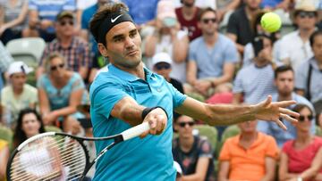 Switzerland's Roger Federer returns the ball to Australia's Nick Kyrgios during their semifinal match at the ATP Mercedes Cup tennis tournament in Stuttgart, southwestern Germany, on June 16, 2018. / AFP PHOTO / THOMAS KIENZLE
