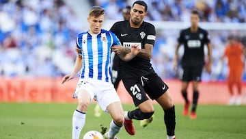 SAN SEBASTIAN, SPAIN - SEPTEMBER 26: Benat Turrientes of Real Sociedad duels for the ball with Omar Mascarell of Elche CF during the La Liga Santader match between Real Sociedad and Elche CF at Reale Arena on September 26, 2021 in San Sebastian, Spain. (P