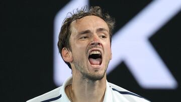 Russia's Daniil Medvedev reacts as he plays against Greece's Stefanos Tsitsipas during their men's singles semi-final match on day twelve of the Australian Open tennis tournament in Melbourne on February 19, 2021. (Photo by David Gray / AFP) / -- IMAGE RESTRICTED TO EDITORIAL USE - STRICTLY NO COMMERCIAL USE --