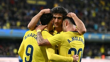 Villarreal's French forward #09 Georges Mikautadze celebrates scoring his team's third goal with Villarreal's Spanish forward #20 Alberto Moleiro and Villarreal's Spanish forward #07 Gerard who scores previously during the Spanish league football match between Villarreal CF and Deportivo Alaves at La Ceramica Stadium in Vila-real on January 10, 2026. (Photo by JOSE JORDAN / AFP)