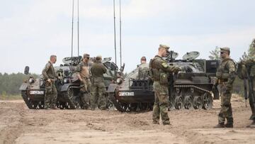 German Members of the NATO enhanced Forward Presence battlegroup are pictured before the arrival of German Chancellor and Lithuanian President Gitanas Nauseda, in Pabrade, Lithuania, on June 7, 2022. (Photo by PETRAS MALUKAS / AFP) (Photo by PETRAS MALUKAS/AFP via Getty Images)