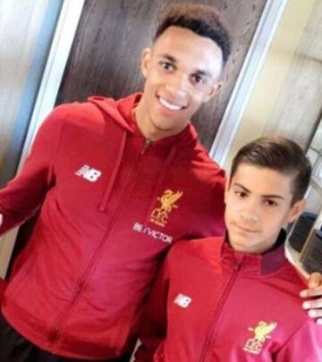 Liverpool's Trent Alexander-Arnold with hero ballboy Oakley Cannonier.