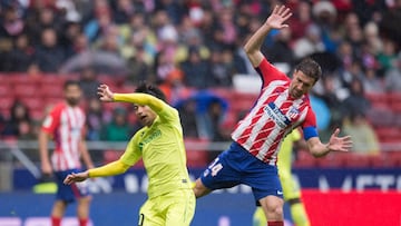 MADRID, SPAIN - JANUARY 06: Gaku Shibasaki of Getafe is fouled by Gabi Fernandez of Atletico de Madridduring the La Liga match between Atletico Madrid and Getafe at estadio Wanda Metropolitano on January 6, 2018 in Madrid, Spain. (Photo by Denis Doyle/Get