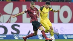 Nuernberg&#039;s German midfielder Hanno Behrens (L) and Dortmund&#039;s English midfielder Jadon Sancho  vie for the ball during the German first division Bundesliga match between 1 FC Nuremberg and Borussia Dortmund in Nuremberg, southern Germany, on Fe