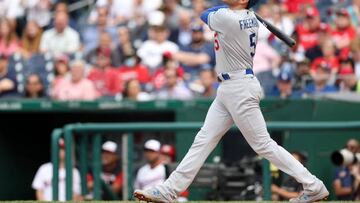 Freddie Freeman goes 4 for 5, leading a withering offensive charge by the Los Angeles Dodgers in their 14-1 rout of the Arizona Diamondbacks in Phoenix.