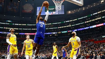 Paul George #13 of the LA Clippers makes the slam dunk against the Los Angeles Lakers in the first half at Crypto.com Arena on January 23, 2024 in Los Angeles, California.