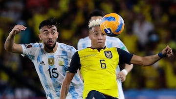 (FILES) In this file photo taken on March 29, 2022 Argentina's Nicolas Gonzalez (L) and Ecuador's Byron Castillo vie for the ball during their South American qualification football match for the FIFA World Cup Qatar 2022 at the Isidro Romero Monumental Stadium in Guayaquil, Ecuador. - Chile's football federation (FFCh) lodged on May 5, 2022 a complaint with FIFA against Ecuador over the alleged ineligibility of full-back Byron Castillo. (Photo by FRANKLIN JACOME / POOL / AFP)