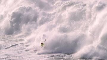 A surfer competes during the Punta Galea Challenge big wave surfing competition in the Northern Spanish city of Getxo on December 10, 2018. (Photo by ANDER GILLENEA / AFP)