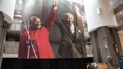 An image depicting the late South African Nobel Peace Price Archbishop Desmond Tutu and the late South African President and Nobel Peace prize laureate Nelson Mandela raising their fists hangs in the main hall of the Cape Town City Centre while  Anglican 