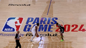 Cleveland Cavaliers' US Point Guard Donovan Mitchell (L) is challenged by Brooklyn Nets' US Point Guard Dennis Smith Jr (R) during the NBA regular season basketball match between the Cleveland Cavaliers and the Brooklyn Nets at the Accor Arena in Paris on January 11, 2024.