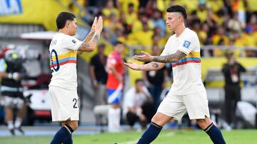 BARRANQUILLA, COLOMBIA - OCTOBER 15: James Rodriguez of Colombia (R) greets teammate Juan Fernando Quintero in a substitution during the FIFA World Cup 2026 South American Qualifier match between Colombia and Chile at Roberto Melendez Metropolitan Stadium on October 15, 2024 in Barranquilla, Colombia. (Photo by Gabriel Aponte/Getty Images)