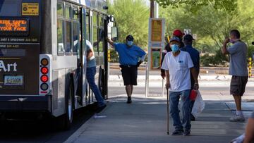 Passengers wear protective face masks to prevent the spread of the coronavirus disease (COVID-19), at the downtown bus station in Tucson, Arizona, U.S., June 20, 2020. REUTERS/Cheney Orr