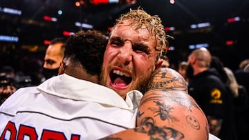 YouTube personality Jake Paul celebrates after knocking out former UFC welterweight champion Tyron Woodley during a fight at the Amalie Arena in Tampa, Florida, on December 18, 2021. (Photo by CHANDAN KHANNA / AFP)