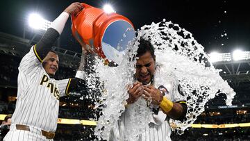 SAN DIEGO, CALIFORNIA - JULY 30: Donovan Solano #39 of the San Diego Padres is doused by Manny Machado #13 after hitting a walk-off single during the tenth inning to defeat the Los Angeles Dodgers 6-5 at Petco Park on July 30, 2024 in San Diego, California. Orlando Ramirez/Getty Images/AFP (Photo by Orlando Ramirez / GETTY IMAGES NORTH AMERICA / Getty Images via AFP)
