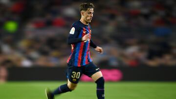 Barcelona's Spanish midfielder Gavi runs with the ball during the Spanish league football match between FC Barcelona and Girona FC at the Camp Nou stadium in Barcelona on April 10, 2023. (Photo by Pau BARRENA / AFP)