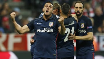 Britain Football Soccer - Bayern Munich v Atletico Madrid - UEFA Champions League Semi Final Second Leg - Allianz Arena, Munich - 3/5/16
 Antoine Griezmann (hidden) celebrates scoring the first goal for Atletico Madrid with Koke and team mates
 Reuters / 