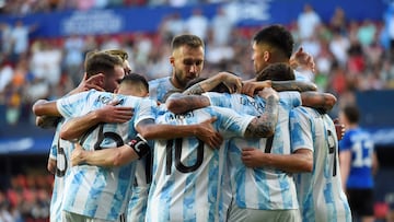 Argentina's forward Lionel Messi (C) celebrates with teammates after scoring his team's second goal during the international friendly football match between Argentina and Estonia at El Sadar stadium in Pamplona on June 5, 2022. (Photo by ANDER GILLENEA / AFP)