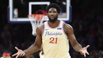 (FILES) In this file photo taken on December 25, 2019, Joel Embiid of the Philadelphia 76ers reacts after scoring during the first half of the game against the Milwaukee Bucks in Philadelphia, Pennsylvania. NOTE TO USER: User expressly acknowledges and agrees that, by downloading and or using this photograph, User is consenting to the terms and conditions of the Getty Images License Agreement. Sarah Stier/Getty Images/AFP - Embiid returned to full workouts on January 24, 2020, with the NBA club and will be re-evaluated Monday, three weeks after undergoing surgery for a torn left ringfinger ligament. The 25-year-old Cameroonian 7-footer will miss Saturday's home game against the Los Angeles Lakers but after the evaluation, a team decision announced on the NBA website, he could be back on the court Tuesday when the 76ers face Golden State. (Photo by Sarah Stier / GETTY IMAGES NORTH AMERICA / AFP)