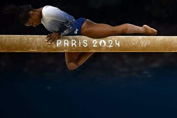 (FILES) US' Simone Biles competes in the artistic gymnastics women's balance beam final during the Paris 2024 Olympic Games at the Bercy Arena in Paris, on August 5, 2024. (Photo by Loic VENANCE / AFP)