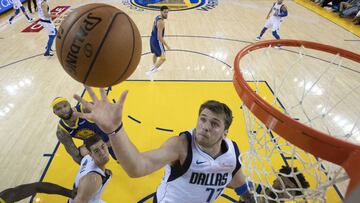 March 23, 2019; Oakland, CA, USA; Dallas Mavericks forward Luka Doncic (77) grabs a rebound against the Golden State Warriors during the second half at Oracle Arena. Mandatory Credit: Kyle Terada-USA TODAY Sports