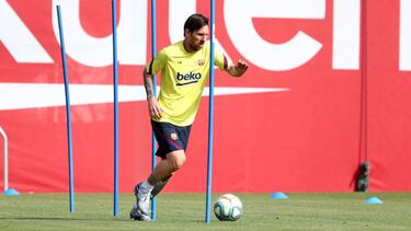 This handout pictured made available by FC Barcelona shows Barcelona's Argentine forward Lionel Messi attending a training session at the Ciutat Esportiva Joan Gamper in Sant Joan Despi on May 8, 2020 as Spain prepares to ease its tough lockdown measures