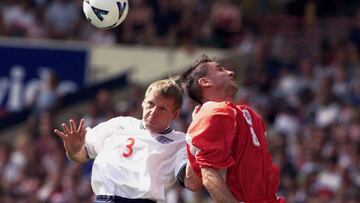 WEM09D:SPORT-SOCCER:WEMBLEY,ENGLAND,4SEP99 - England defender Stuart Pearce (L) goes up for a header with Jean Vanek of Luxembourg at Wembley in their European Championship qualifier September 4.  ms/Photo by Ian Waldie REUTERS