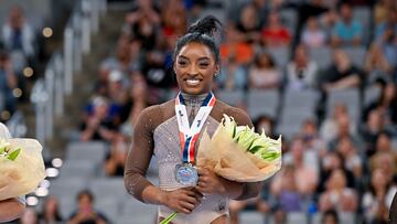 Jun 2, 2024; Fort Worth, Texas, USA; Simone Biles of World Champions Centre poses for a photo with her gold medal and commemorative belt buckle after finishing in first in the women’s 2024 Xfinity U.S. Gymnastics Championships at Dickies Arena. Mandatory Credit: Jerome Miron-USA TODAY Sports