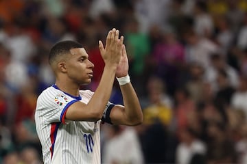 France's forward #10 Kylian Mbappe applauds celebrates after losing the UEFA Euro 2024 semi-final football match between Spain and France at the Munich Football Arena in Munich on July 9, 2024. (Photo by FRANCK FIFE / AFP)