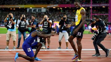 Justin Gatlin of the U.S. kneels down in front of Usain Bolt of Jamaica after the final of the Men's 100 Metres final during the World Athletics Championships at London Stadium, London, Britain, August 5, 2017. REUTERS/Phil Noble/File Photo SEARCH "POY SPORT" FOR THIS STORY. SEARCH "REUTERS POY" FOR ALL BEST OF 2017 PACKAGES. TPX IMAGES OF THE DAY