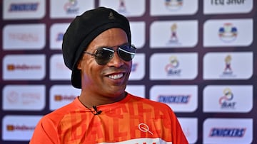 Former Brazilian football player Ronaldinho speaks to AFP during the World Teqball Championships at the Bangkok Arena in Bangkok on December 3, 2023. (Photo by Lillian SUWANRUMPHA / AFP)