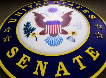 US Senate seal hangs on the wall inside the Senate Radio-TV gallery on Capitol Hill in Washington, DC