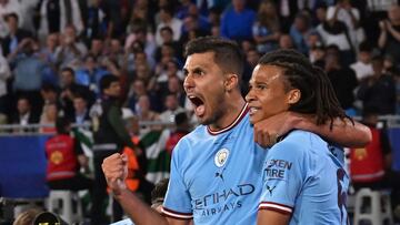 Manchester City's Spanish midfielder #16 Rodri (L) celebrates scoring his team's first goal with Manchester City's Dutch defender #6 Nathan Ake during the UEFA Champions League final football match between Inter Milan and Manchester City at the Ataturk Olympic Stadium in Istanbul, on June 10, 2023. (Photo by FRANCK FIFE / AFP)