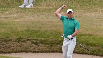 Northern Ireland's Rory McIlroy celebrates after holing a bunker shot for an eagle on the 10th hole during his third round on day 3 of The 150th British Open Golf Championship on The Old Course at St Andrews in Scotland on July 16, 2022. (Photo by Glyn KIRK / AFP) / RESTRICTED TO EDITORIAL USE