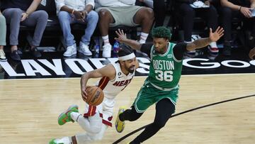 Gabe Vincent #2 of the Miami Heat drives against Marcus Smart #36 of the Boston Celtics