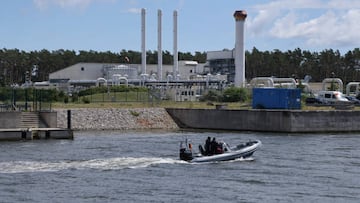 LUBMIN, GERMANY - JULY 11: A police boat motors past the receiving station for the Nord Stream 1 natural gas pipeline on July 11, 2022 near Lubmin, Germany. The pipeline, which transports natural gas from Russia to Germany, is undergoing maintenance for ten days as of today, meaning that gas deliveries have halted. German authorities are unsure whether gas flows will resume after July 21, when the maintenance work is scheduled to end, given current tensions between Germany and Russia over Russia's ongoing war in Ukraine. Germany is seeking to ween itself off Russian gas and oil imports, though it will remain dependent for the near future. Concerns have grown whether Germany will face natural gas shortages this coming winter.  (Photo by Sean Gallup/Getty Images)