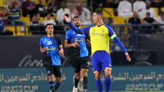 Nassr's Portuguese forward Cristiano Ronaldo (R) reacts as he runs with the ball during the King Cup quarter-final football match between al-Nassr and Abha at Mrsool Park Stadium in Riyadh on March 14, 2023. (Photo by Fayez NURELDINE / AFP) (Photo by FAYEZ NURELDINE/AFP via Getty Images)