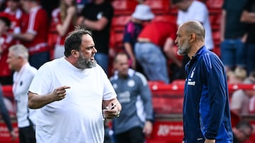 Nottingham Forest's Portuguese manager Nuno Espirito Santo (R) speaks with Nottingham Forest's Greek co-owner Evangelos Marinakis (L) at the end of the English Premier League football match between Nottingham Forest and Leicester City at The City Ground in Nottingham, central England, on May 11, 2025. Nottingham Forest and Leicester City equalise 2 - 2. (Photo by JUSTIN TALLIS / AFP) / RESTRICTED TO EDITORIAL USE. No use with unauthorized audio, video, data, fixture lists, club/league logos or 'live' services. Online in-match use limited to 120 images. An additional 40 images may be used in extra time. No video emulation. Social media in-match use limited to 120 images. An additional 40 images may be used in extra time. No use in betting publications, games or single club/league/player publications. /