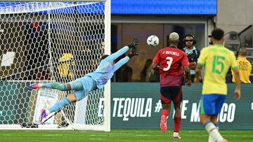 Costa Rica's goalkeeper #01 Kevin Chamorro jumps to try and save the ball during the Conmebol 2024 Copa America tournament group D football match between Brazil and Costa Rica at SoFi Stadium in Inglewood, California on June 24, 2024. (Photo by Patrick T. Fallon / AFP)