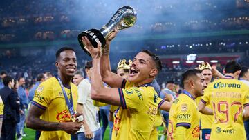 Jonathan Dos Santos of America celebrates victory with the champion trophy during the final second-leg match between Monterrey and America as part of the Torneo Apertura 2024 Liga MX at BBVA Bancomer Stadium, on December 15, 2024 in Monterrey, Nuevo Leon, Mexico.