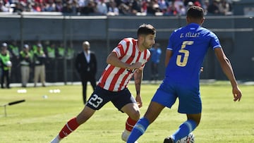 Paraguay's midfielder Mathias Villasanti (L) fights for the ball with Nicaragua's defender Erick Telez during the friendly football match between Paraguay and Nicaragua at the Defensores del Chaco stadium in Asuncion on June 18, 2023. (Photo by NORBERTO DUARTE / AFP)