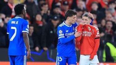 (FILES) SL Benfica's Argentine forward #25 Gianluca Prestianni hides his mouth while arguing with Real Madrid's Brazilian forward #07 Vinicius Junior who complained about alleged racists insults during the UEFA Champions League knockout round play-off first leg football match between SL Benfica and Real Madrid CF at Estadio da Luz in Lisbon on February 17, 2026. UEFA on February 23, 2026 suspended midfielder Gialuca Prestianni from Benfica's Champions League play-off second leg against Real Madrid this week after he was accused of racially abusing Vinicius Junior. (Photo by PATRICIA DE MELO MOREIRA / AFP)