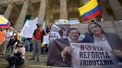 People demonstrate against a tax reform proposed by the government of leftist President Gustavo Petro, in Bogota, on September 26, 2022. - The 62-year-old former guerrilla and one-time mayor Petro, took over on August 7 with plans for profound reforms in a country beset by economic inequality and drug violence. (Photo by Raul ARBOLEDA / AFP) (Photo by RAUL ARBOLEDA/AFP via Getty Images)