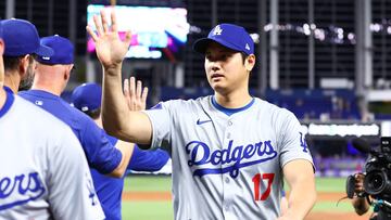 MIAMI, FLORIDA - SEPTEMBER 19: Shohei Ohtani #17 of the Los Angeles Dodgers high fives teammates after defeating the Miami Marlins at loanDepot park on September 19, 2024 in Miami, Florida. Megan Briggs/Getty Images/AFP (Photo by Megan Briggs / GETTY IMAGES NORTH AMERICA / Getty Images via AFP)