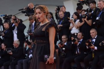 Italian singer and actress Lola Ponce poses on the red carpet as she arrives for the opening ceremony of the 73rd Venice Film Festival, on August 31, 2016 at Venice Lido. / AFP PHOTO / FILIPPO MONTEFORTE