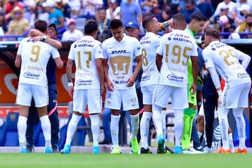 Pumas players hug during the 17th round match between Pumas UNAM and Pachuca 