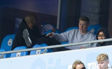 Kevin De Bruyne watches the Huddersfield game from the stands