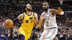 Ricky Rubio penetra ante Kyrie Irving.