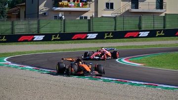 McLaren's Australian driver Oscar Piastri races ahead of Ferrari's Monegasque driver Charles Leclerc during the second practice session for the 2025 Emilia Romagna Formula One Grand Prix at the Imola autodrome in Imola, on May 16, 2025. (Photo by Andrej ISAKOVIC / AFP)
