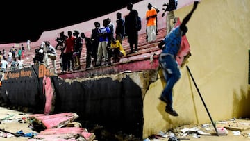 People look at the scene after a wall collapsed at Demba Diop stadium July 15, 2017 in Dakar after a football game between local teams Ouakam and Stade de Mbour. 